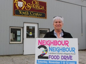 Connie McFadden, a local organizer with Saturday's Neighbour2Neighbor Food Drive, stands Thursday outside the youth community centre in Oil Springs.