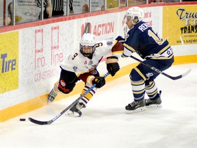 Forward Harry Clark, shown battling along the boards for a loose puck behind the Kirkland Lake net with Gold Miners D-man Lucas Renzoni during an NOJHL game at the McIntyre Arena on Feb. 26, has officially signed with the Timmins Rock. Clark, who spent the 2019-20 season with the GNML’s Timmins Majors, got into four games with the Rock as an affiliate player. FILE PHOTO/THE DAILY PRESS