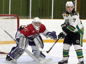 Rayside-Balfour Canadians goaltender David Bowen (34) looks to fend off Elliot Lake Wildcats forward Owen Kruse (77) during first-period NOJHL action at Chelmsford Arena in Chelmsford, Ontario on Friday, October 10, 2019.