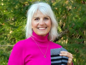 Leslie Cassidy-Amadio, organizer of JOY-Full Socks, displays one of the many pairs of thermal socks the campaign will collect this month.  She says thermal socks make excellent gifts for individuals who cannot afford to buy winter boots.  Marguerite LaHaye