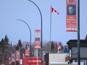 Banners hang off light poles to honour veterans along 110 Street in Fairview, Alta. on Saturday, Oct. 31, 2020.