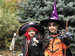 Brayden, 3 as a pirate and Jocelyn Vandyke, 5 as a witch.