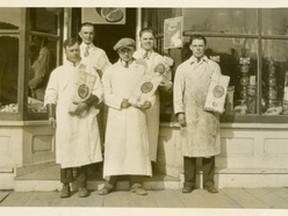 AR89.33 - Henry Jerry outside his Peace River Butcher Shop. Henry on left back row. The man next to him may have been a salesman for Brookfield Cheese. In front (l-r) Bill Luscombe, Laverne McLure and Scotty Boyd. The circa 1930 photograph was found in the closet of the old Jerry house across the street from the Centennial Parking Lot, when Carefree Travel owners renovated the house for their business at 9801-101 Street in 1989. The building is now for sale.
