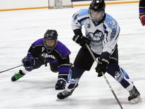 Phillip Doxtator, left, of Rama, attempts to block a shot by Jason Bednarski, of Whitefish River, during action at the bantam boys "B" championship at the Little Native Hockey League tournament at the Countryside Sports Complex in Sudbury on Wednesday, March 14, 2012. Whitefish River won 7-1. JOHN LAPPA/THE SUDBURY STAR/QMI AGENCY