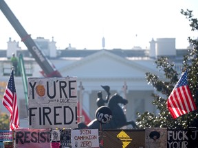 A "You're Fired" sign hangs atop a fence in front of the White House, days after former Vice President Joe Biden was declared the winner of the 2020 U.S. presidential election, in Washington, DC, U.S., November 9, 2020. REUTERS/Hannah McKay