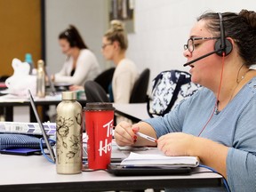 Erin Stirling (right), Danielle Fordham and Allison Valley teach in the Lambton Kent District School Board's virtual elementary school at Blenheim District High School in Blenheim. Mark Malone/Postmedia Network