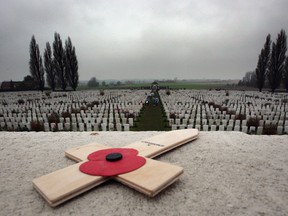 A poppy is left on a memorial  in the Tyne Cot Cemetery, the largest Commonwealth war grave cemetery in the world, near Ypres, Belguim. The Commonwealth War Grave Commission manages 956 cemeteries in Belguim and France, which bear witness to the heavy human sacrifice made on the Western Front during the First World War (1914-1918) and Second World War (1939-1945). Photo by Matt Cardy/Getty Images