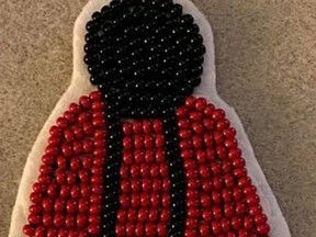 Red dress pins, created by local Cree designer Cree-ative Designs, are being used to raise awareness for Missing and Murdered Indigenous Women and Girls. Photo Supplied.