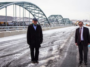 Transportation Minister McIver (left) and Peace River mayor Tom Tarpey on the deck of the newly opened Peace River bridge.