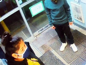 The suspects shown made off with two 12-packs of beet after robbing a beer store on Saskatchewan Avenue in Portage la Prairie. (supplied photo)