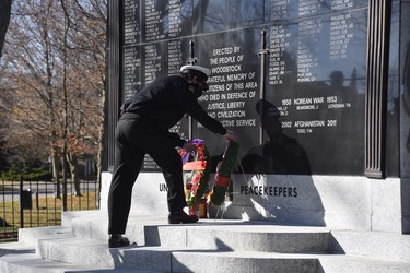 People were invited to pin their poppies on a small number of wreathes laid at the cenotaph following a ceremony at Goff Hall Wednesday morning. (Kathleen Saylors/Woodstock Sentinel-Review)