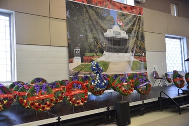 Wreathes were laid at a small ceremony at Goff Hall, where a photo of the cenotaph was hung at near-life size to serve as a backdrop, much like it would had the ceremony been held downtown. (Kathleen Saylors/Woodstock Sentinel-Review)