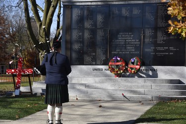 Piper Dylan Powell of the Huntingford Highlanders plays at the Woodstock cenotaph Wednesday morning following the official ceremony at Goff Hall. (Kathleen Saylors/Woodstock Sentinel-Review)