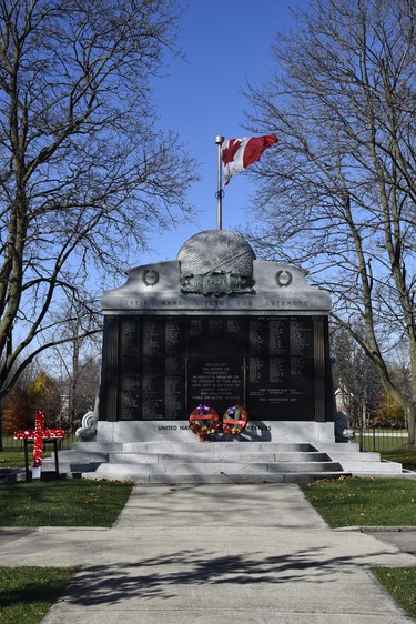 Representatives from the Royal Canadian Legion Branch 55 in Woodstock laid a small number of wreathes, and a cross, at the Woodstock cenotaph Wednesday for Remembrance Day, though the official ceremony was held at Goff Hall. (Kathleen Saylors/Woodstock Sentinel-Review)