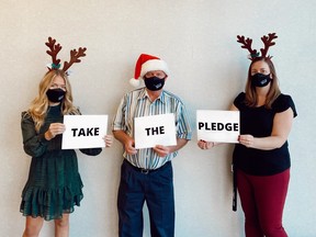 Perth County's economic development and tourism department is asking residents to "Take the Pledge" to complete at least 70 per cent of their holiday shopping locally this year to support local businesses during the COVID-19 pandemic. Pictured from left are Perth County tourism officer Ashley Brockelbank, Perth County Warden Jim Aitcheson, and Perth County economic development and communications officer Sarah Franklin. Submitted photo