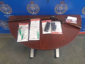 A photo provided by Sarnia police shows guns and weapons allegedly seized Thursday.