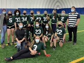 Lockerby Vikings flag football players and coaches pose for a photo after winning a championship on Thursday night.