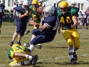 The Confederation Chargers take on the Notre Dame Alouettes in boys high school football in 2004. Both teams made memorable runs to city championships during the first decade of the millennium.