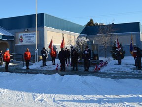 Residents gathered outside of the Royal Canadian Legion Branch 84 in Fairview, Alta. to witness the Remembrance Day ceremony in front of the cenotaph on Wednesday, Nov. 11, 2020.
