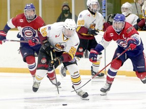 Timmins Rock blue-liner Brendan Boyce, carrying the puck while being pursued by Rayside-Balfour Canadians forward Brady Maltais during first-period NOJHL action at the Chelmsford Arena on Sunday, has been selected as one of the initial Eastlink TV 3 Stars of the Week. BEN LEESON/POSTMEDIA NETWORK