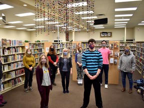 Local youth from the Junior Youth Group and Local Youth Experience were at the Devon Library on Monday, Nov. 16 to see their newly installed art project. (Emily Jansen)
