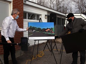North Bay and District Humane Society executive director Liam Cullin, left, and Marcus Wheeler of Bertrand Wheeler Architecture reveal the design of the organization's new adoption centre during a media conference, Thursday morning. Michael Lee/The Nugget