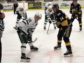 The Spruce Grove Saints defeared the Sherwood Park Crusaders 4-3 in overtime on Friday to kick off the AJHL season. Here Saints centre Jacob Rochford and Crusaders centre Ty Mueller eye the puck in the referees hand prior to puck drop.