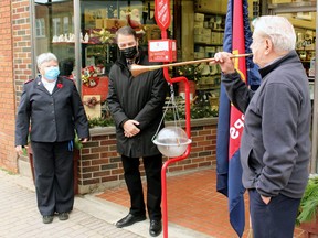 Ralph Diegel plays as fanfare as Maj. Bonita McGory of the Salvation Army and Nipissing-Timiskaming MP Anthony Rota watch, Friday, at the official launch of the Salvation Army Kettle Campaign.
PJ Wilson/The Nugget