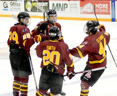 Timmins Rock players, from left, Brendan Boyce, Evan Beaudry, Zach Smith and Tyler Schwindt celebrate Boyce’s second-period power-play marker. The goal proved to be the game-winner as the Rock went on to blank the Rayside-Balfour Canadians 2-0 Sunday night at the McIntyre Arena. THOMAS PERRY/THE DAILY PRESS/POSTMEDIA NETWORK