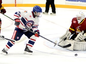 Rayside-Balfour Canadians forward Nicholas Faught tries to gain control of a rebound in front of Timmins Rock goalie Tyler Masternak during the first period of Sunday night’s NOJHL contest at the McIntyre Arena. Masternak stopped all 20 shots he faced to record his NOJHL-record 17th career shutout as the Rock went on to blank the Canadians 2-0, sweeping their two-game weekend series. THOMAS PERRY/THE DAILY PRESS/POSTMEDIA NETWORK