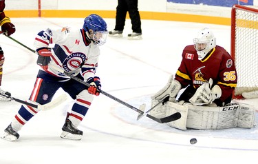 Rayside-Balfour Canadians forward Nicholas Faught tries to gain control of a rebound in front of Timmins Rock goalie Tyler Masternak during the first period of Sunday night’s NOJHL contest at the McIntyre Arena. Masternak stopped all 20 shots he faced to record his NOJHL-record 17th career shutout as the Rock went on to blank the Canadians 2-0, sweeping their two-game weekend series. THOMAS PERRY/THE DAILY PRESS/POSTMEDIA NETWORK