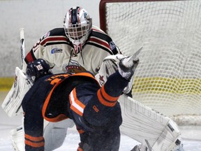 PETER RUICCI/Sault Star

Soo Thunderbirds defenceman Connor Toms gets tripped and falls into Blind River netminder Wyatt Courchaine during NOJHL action in the Sault on Friday. The Beavers won that game and Saturday's clash in Blind River