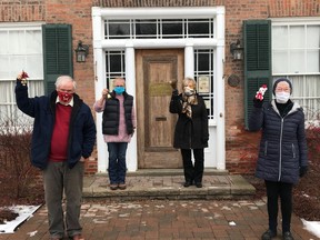 The Norfolk County Heritage & Culture department is hoping the community will come together to ring bells on their porches at 6 p.m. on Christmas Eve to spread some cheer. Members of the Heritage Committee ringing bells include, from left, Bob Woods, Joan Norman, Karen Culver, Mary Caughill. (CONTRIBUTED)