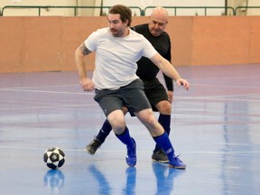 The 25th season of the indoor soccer league in Norfolk started on Saturday afternoon. The game was between Covid Blue and Port Dover, with Blue taking it 8-2. Joe Archer and Louis Ribbero fight for the ball. (ASHLEY TAYLOR)