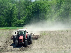 A Lambton County farmer planting crops, in a file photo from 2013. The Ausalbe Bayfield Conservation Authority says the planting of cover crops in Huron County has reached record levels. File photo/Postmedia Network