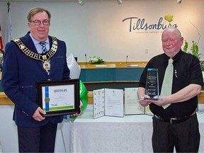 Doug Cooper, right, received the Tillsonburg 2020 Citizen of the Year Award from Mayor Stephen Molnar on Tuesday, Nov. 17. (Submitted/Brian Cooper)