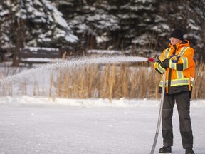 Muskoseepi Park’s Al Meyer floods the ice surface of the fish pond as he works on preparing it for another winter of use by skaters Friday, Nov. 11, 2020.