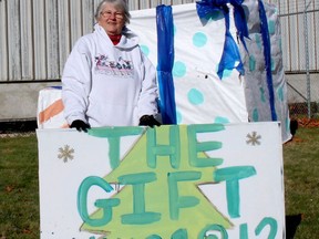 Mary Williston, a long-time Chatham Goodfellows volunteer is doing double-duty this year by also volunteering for The Gift CK. She is seen here Wednesday in front of the warehouse on Richmond Street in Chatham that both organizations are using. Ellwood Shreve/Postmedia Network