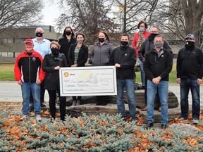 Members of the Captain Kidd Days organizing committee gave out $18,000 to seven different community groups on Nov. 13. Front row (from left to right): Mooretown Junior C Flags’ Chuck Melton, Captain Kidd Days committee member Ashley Robbins, Corunna Minor Ball’s Andrea Hands, Mooretown Lady Flags’ Andrea Lane, Shell Canada’s Bryant Bird and Sebastien Robert, Captain Kidd Days committee member Steve Lane. Back row (from left to right): St. Clair Child and Youth’s Craig McKenzie, CMHA Lambton-Kent’s Andria Appeldoorn, Sarnia-Lambton Rebound’s Anita Minielly and Captain Kidd Days committee member Geoff Dale. Carl Hnatyshyn/Sarnia This Week