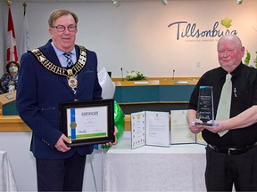 Doug Cooper (right) received the Tillsonburg 2020 Citizen of the Year Award from Mayor Stephen Molnar on Tuesday, Nov. 17. (Submitted/Brian Cooper)