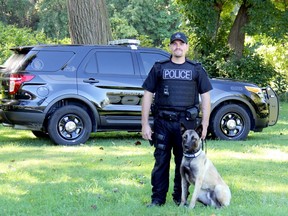 Const. Rick Bertok and his canine partner Arry are seen in this file photo taken September 17, 2013, shortly after they began working together.