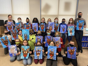 Local teacher Carole Bossert and her Grade 5 students from SouthPointe School display their holiday-themed artwork they will send to their senior buddies at the Southfort Bend Gardens as part of the Seniors and Youth Networking Community (SYNC.) Photos Supplied by Carole Bossert.
