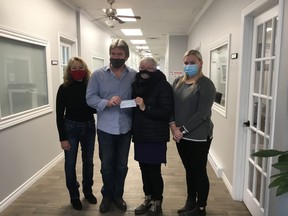 Linda, Keith and Mercedes (far right) Battler ecently donated $1,000 to the Huron Shores Hospice in memory of their sister-in-law, Marie Wilson, who resided there. Receiving the cheque is Cheryl Cottrill, Huron Shores Hospice.