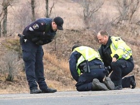 Greater Sudbury Police investigate a fatal collision involving a pedestrian and a pickup on MR 55 between Balsam Street and Big Nickel Road in Greater Sudbury on Friday. John Lappa/Postmedia Network