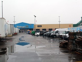Trailers are parked in a fenced-off area of the parking lot in front of Walmart in North Bay, Thursday. The clean-up effort continues while police and the Ontario Fire Marshal's Office continue their investigations into a Friday fire.
PJ Wilson/The Nugget
