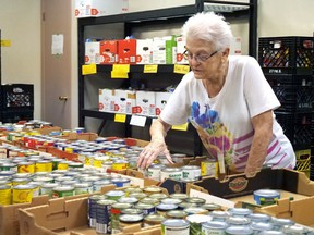 The Helping Hand Food Bank in Tillsonburg is introducing a new 12 Days of Giving food drive in December. Food donations can be dropped off in the alley behind the food bank (55 Broadway) on Dec. 12 and Dec. 19 from 9 a.m. to 3 p.m. Last year's one-day fall food blitz, shown here, brought in nearly 20,000 pounds of food. (Chris Abbott/Postmedia News file photo)