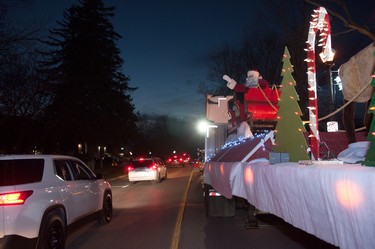 Santa Claus waves to passing vehicles from his sleigh during the annual Parade of Lights in Stratford on Sunday. Chris Montanini/Stratford Beacon Herald