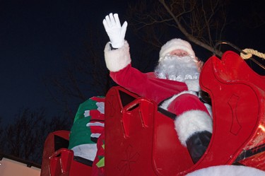 Santa Claus waves to passing vehicles from his sleigh during the annual Parade of Lights in Stratford on Sunday. Chris Montanini\Stratford Beacon Herald