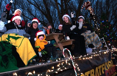 Employees of Stratford Crane Rentals enthusiastically greeted parade-goers during the annual Parade of Lights in Stratford on Sunday. Chris Montanini\Stratford Beacon Herald