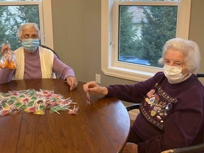 Marjorie Morrison and Evelyn Phillips hard at work putting together goody bags for the revised Santa Claus parade, which took place on Friday, November 27. SUBMITTED
